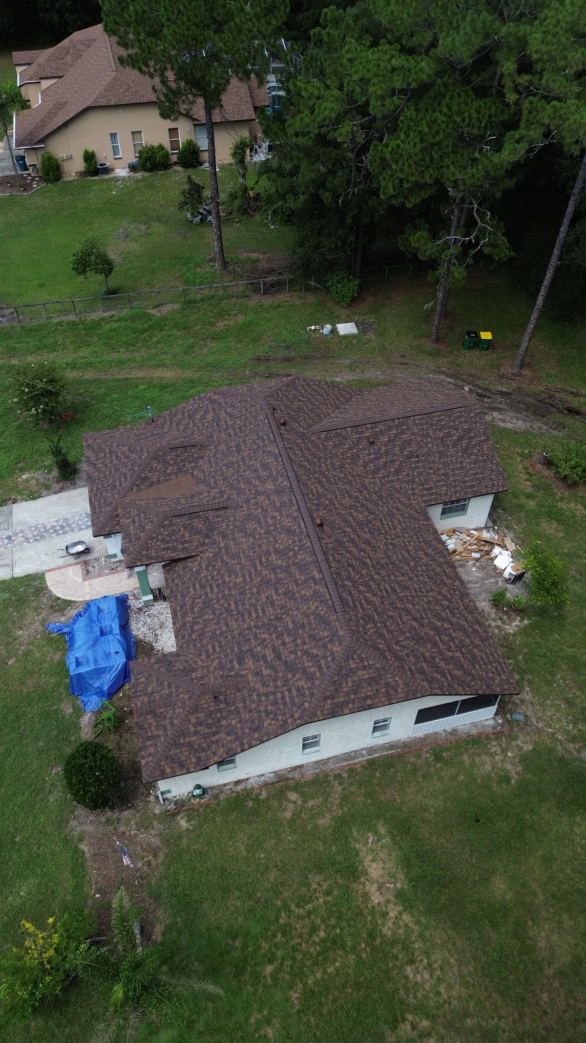 Brown shingle roof seen from above during a roofing project.