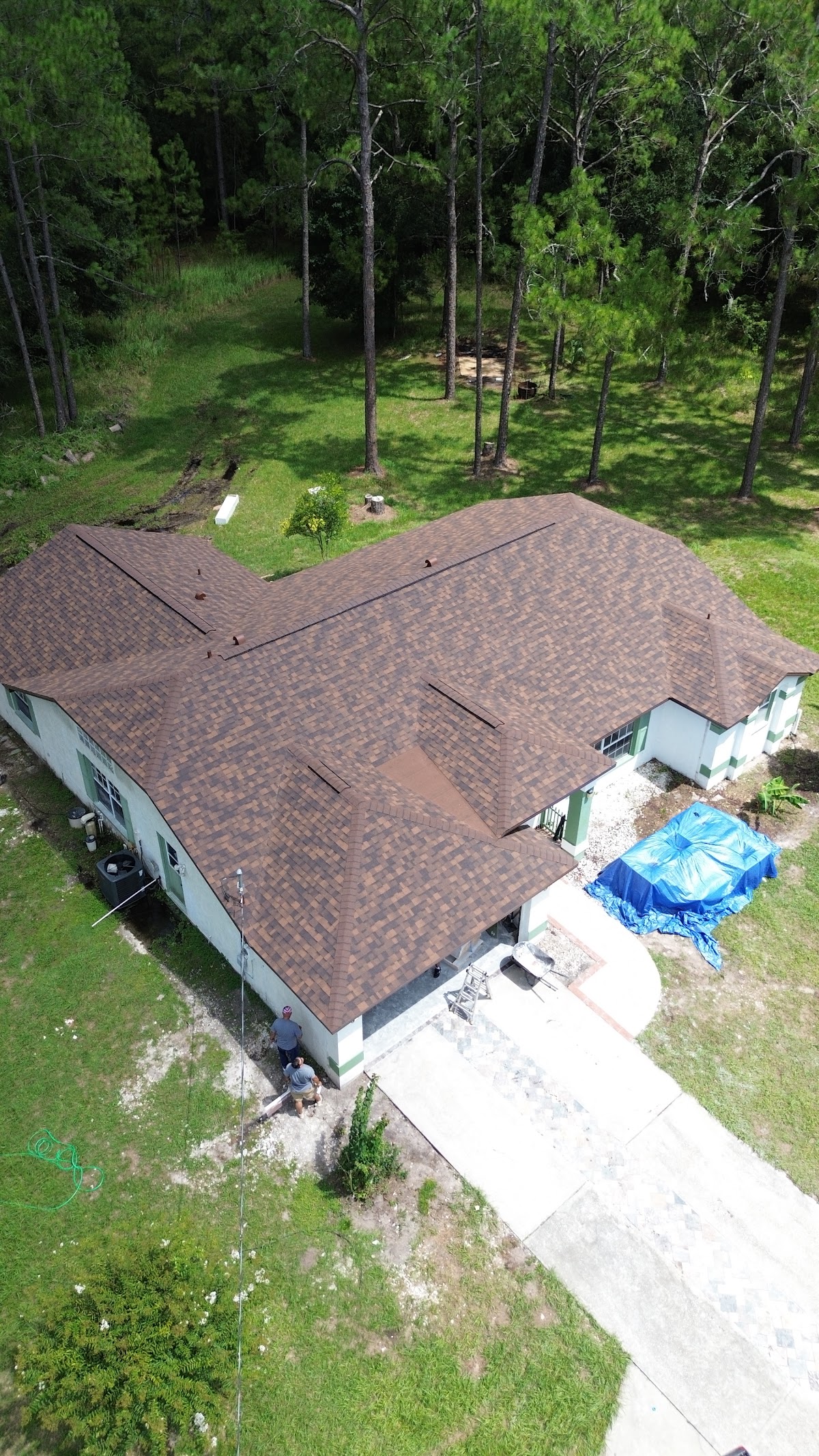 Completed brown shingle roof on a home.